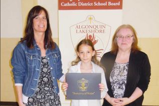 Vice-principal Anna Coe and board trustee Wendy Procter presented grade five student Ariel Lee with the schools annual Beacon of Hope Award
